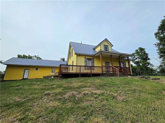 10 Browns Ridge Rd, Rockport, WV 26169 - rear view of property featuring a metal roof and a lawn