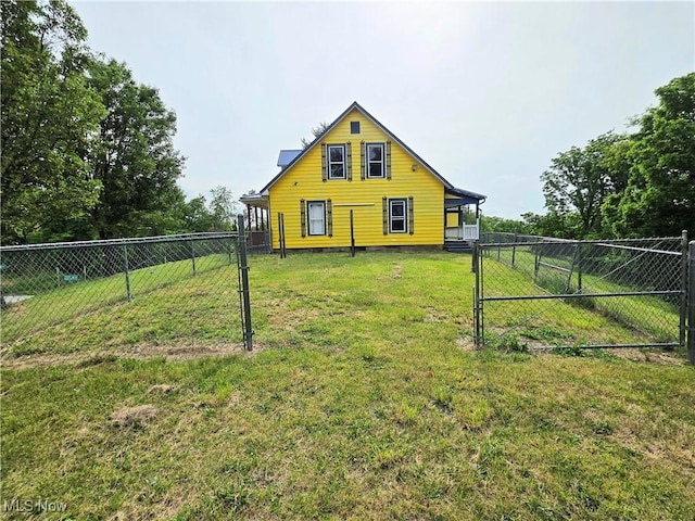 10 Browns Ridge Rd, Rockport, WV 26169 - back of house with a gate, a fenced backyard, and crawl space