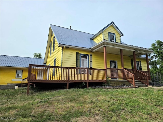 10 Browns Ridge Rd, Rockport, WV 26169 - back of house featuring a metal roof and a yard