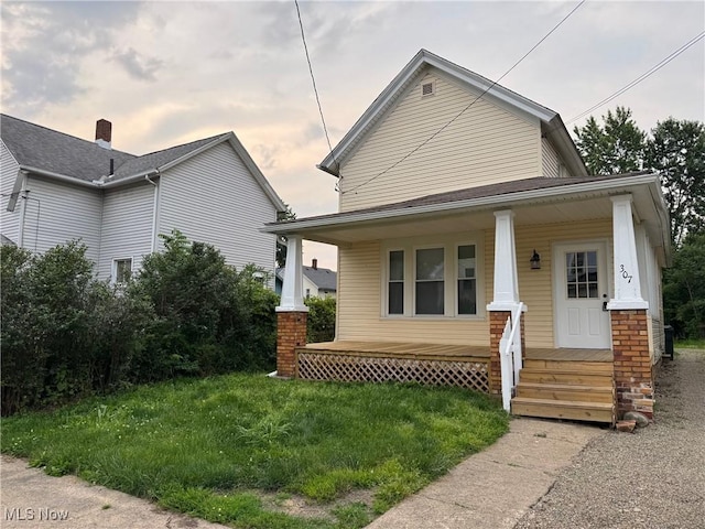 307 Lucas St, Barberton, OH 44203 - view of front of home featuring covered porch