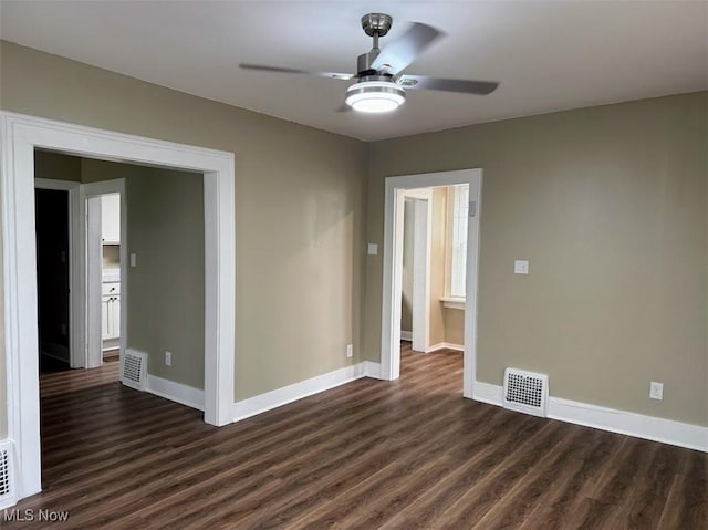 307 Lucas St, Barberton, OH 44203 - spare room featuring dark wood-type flooring and a ceiling fan
