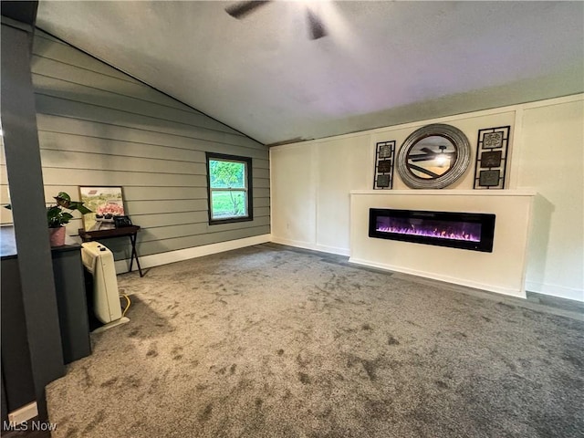 1121 Old Rosemar Rd, Parkersburg, WV 26104 - unfurnished living room with lofted ceiling, carpet flooring, a glass covered fireplace, and ceiling fan