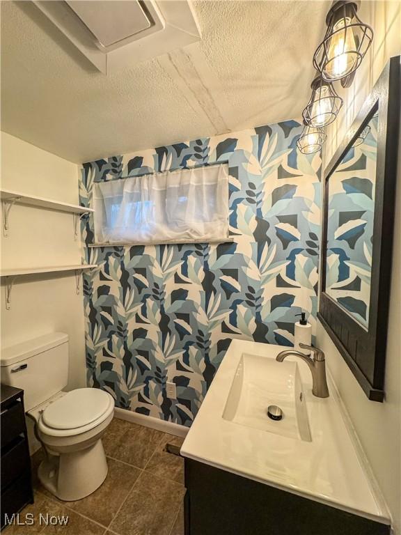 1121 Old Rosemar Rd, Parkersburg, WV 26104 - full bathroom featuring vanity, a textured ceiling, wallpapered walls, and tile patterned floors