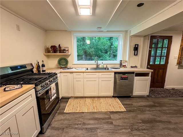 1121 Old Rosemar Rd, Parkersburg, WV 26104 - kitchen featuring stainless steel appliances, dark wood finished floors, white cabinets, and plenty of natural light