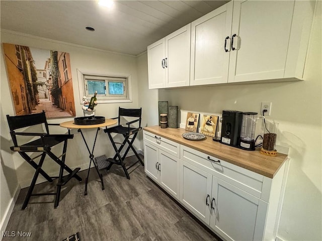 1121 Old Rosemar Rd, Parkersburg, WV 26104 - kitchen with wooden counters, dark wood finished floors, and white cabinetry