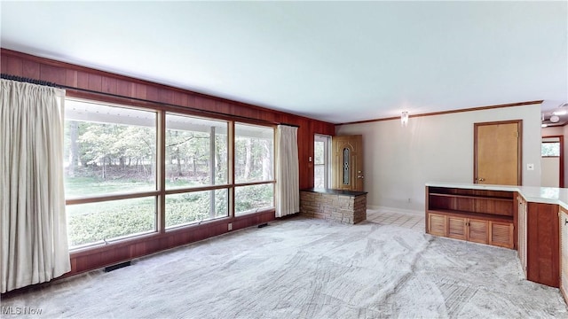 7780 Clarion Dr, Chagrin Falls, OH 44022 - unfurnished living room featuring carpet and crown molding