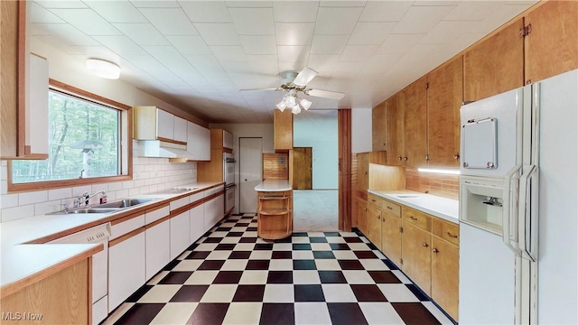 7780 Clarion Dr, Chagrin Falls, OH 44022 - kitchen featuring white appliances, tile patterned floors, light countertops, a ceiling fan, and under cabinet range hood