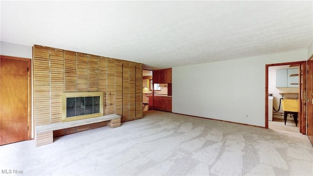7780 Clarion Dr, Chagrin Falls, OH 44022 - unfurnished living room with light colored carpet and a fireplace