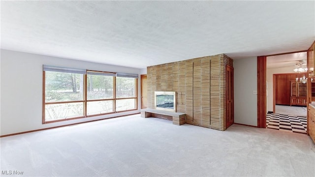 7780 Clarion Dr, Chagrin Falls, OH 44022 - unfurnished living room with light colored carpet and a brick fireplace