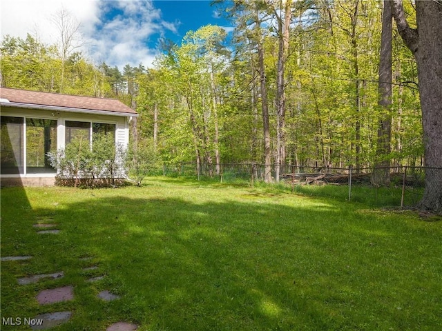 7780 Clarion Dr, Chagrin Falls, OH 44022 - view of yard featuring a sunroom and a forest view