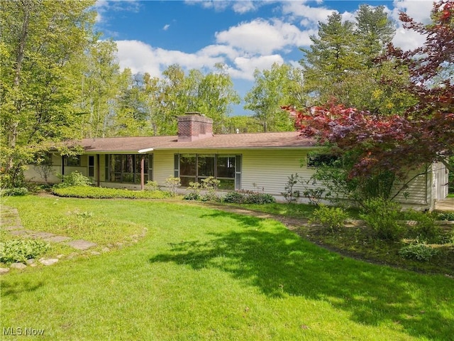 7780 Clarion Dr, Chagrin Falls, OH 44022 - rear view of house with a yard and a chimney
