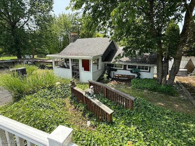 217 Meadowbrook Ave, Boardman, OH 44512 - view of front of house featuring a chimney and roof with shingles