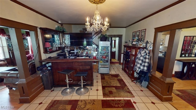 217 Meadowbrook Ave, Boardman, OH 44512 - kitchen featuring ornamental molding, a chandelier, light tile patterned flooring, hanging light fixtures, and freestanding refrigerator