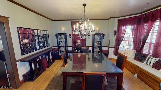 217 Meadowbrook Ave, Boardman, OH 44512 - dining room with wood finished floors, a chandelier, and crown molding