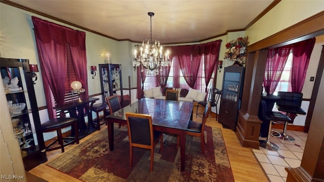 217 Meadowbrook Ave, Boardman, OH 44512 - dining area with a chandelier, ornamental molding, healthy amount of natural light, and wood finished floors