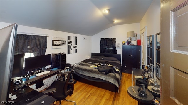 217 Meadowbrook Ave, Boardman, OH 44512 - bedroom featuring wood finished floors, lofted ceiling, and a desk