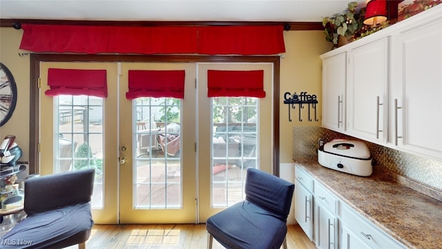 217 Meadowbrook Ave, Boardman, OH 44512 - doorway with light wood-type flooring and french doors