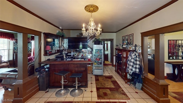 217 Meadowbrook Ave, Boardman, OH 44512 - indoor bar with ornamental molding, a chandelier, decorative light fixtures, and light tile patterned floors