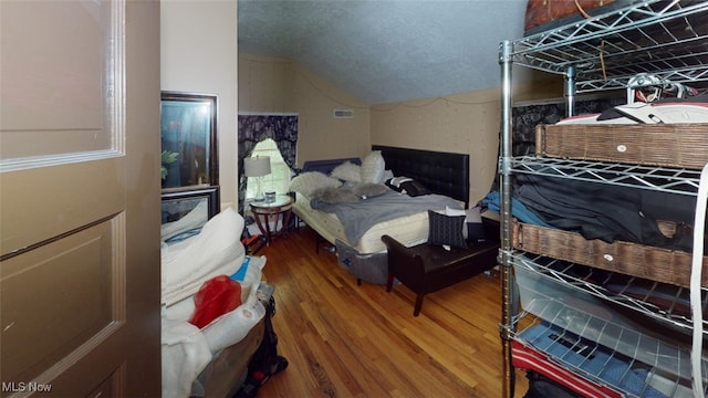 217 Meadowbrook Ave, Boardman, OH 44512 - bedroom featuring vaulted ceiling and wood finished floors