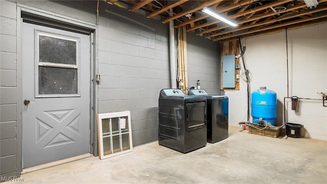 9910 Matchett Rd, Norwich, OH 43767 - unfinished below grade area featuring separate washer and dryer, electric panel, a water pressure tank, and concrete block wall
