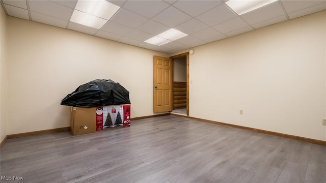 9910 Matchett Rd, Norwich, OH 43767 - empty room with wood finished floors and a drop ceiling