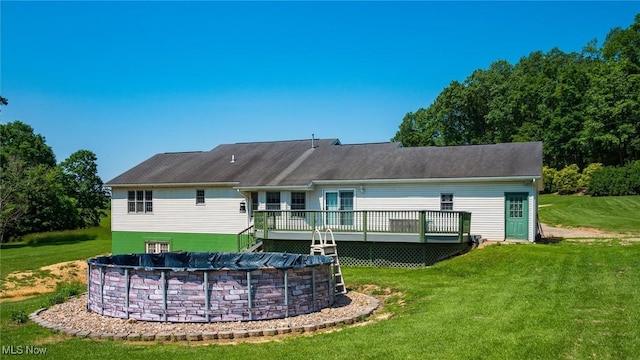 9910 Matchett Rd, Norwich, OH 43767 - rear view of property with a wooden deck, a lawn, and a covered pool