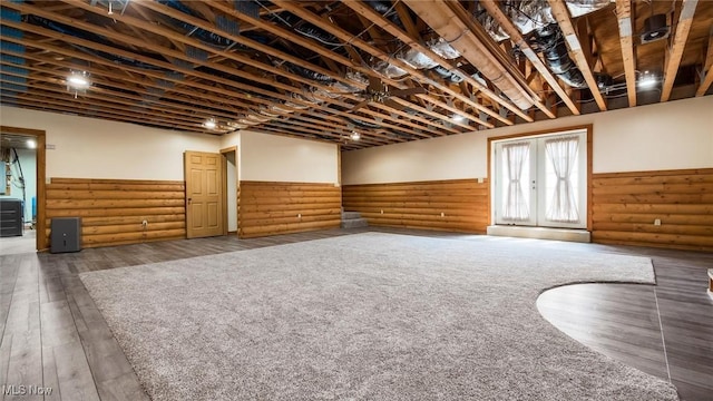 9910 Matchett Rd, Norwich, OH 43767 - below grade area with a wainscoted wall, wood finished floors, and french doors