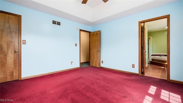 9910 Matchett Rd, Norwich, OH 43767 - unfurnished bedroom featuring carpet flooring, ensuite bathroom, and ceiling fan