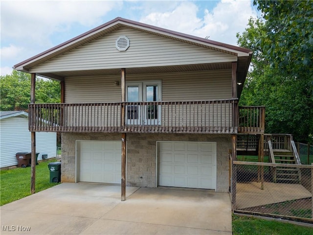 1104 4th St, Belpre, OH 45714 - view of front of home featuring driveway, an attached garage, and stairway