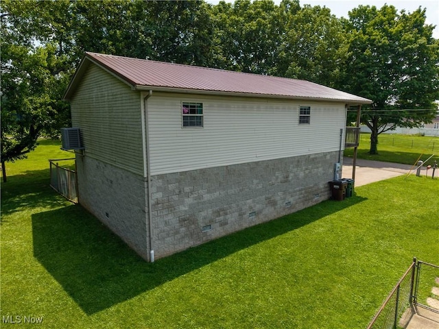1104 4th St, Belpre, OH 45714 - view of side of property featuring a metal roof and crawl space