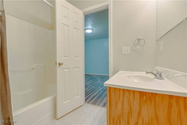 1104 4th St, Belpre, OH 45714 - bathroom with tile patterned flooring, vanity, and shower / tub combo with curtain