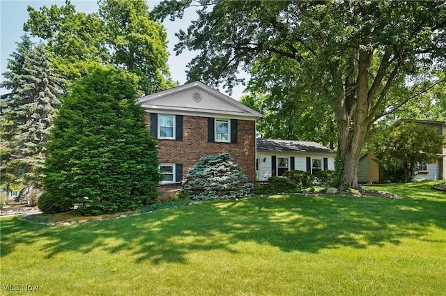 240 S Park Dr, Aurora, OH 44202 - view of front of home featuring a front lawn and brick siding