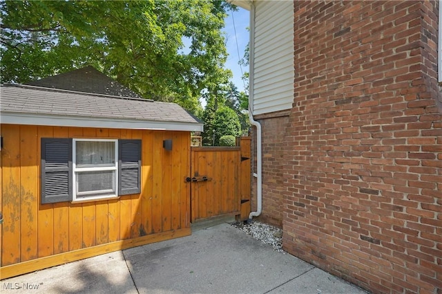 240 S Park Dr, Aurora, OH 44202 - view of side of home with a gate and brick siding