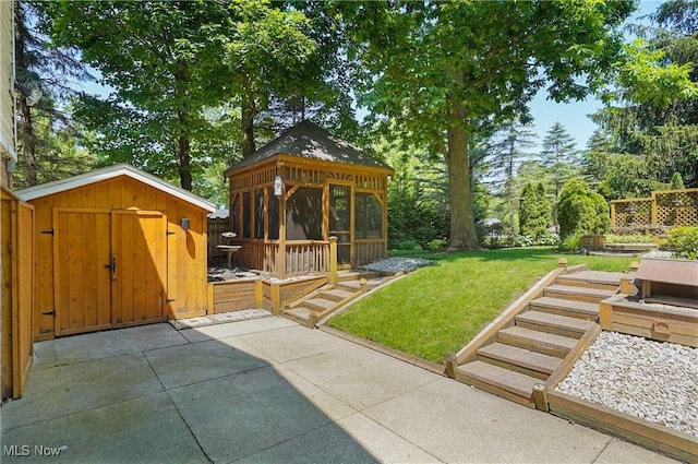 240 S Park Dr, Aurora, OH 44202 - view of grassy yard featuring a gazebo, a shed, a deck, and a patio area