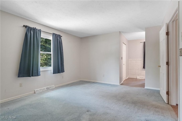 240 S Park Dr, Aurora, OH 44202 - carpeted empty room featuring a textured ceiling and baseboards