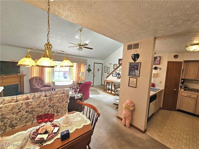 3308 Trappers Trl Unit A, Cortland, OH 44410 - dining room with a textured ceiling, ceiling fan, light carpet, a fireplace, and vaulted ceiling