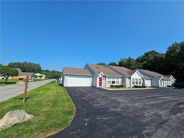 3308 Trappers Trl Unit A, Cortland, OH 44410 - ranch-style home featuring driveway, an attached garage, and a front yard