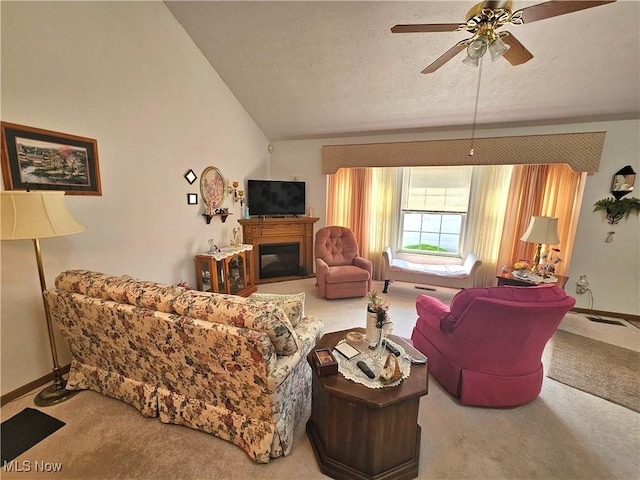 3308 Trappers Trl Unit A, Cortland, OH 44410 - living room featuring carpet flooring, vaulted ceiling, a ceiling fan, a glass covered fireplace, and a textured ceiling