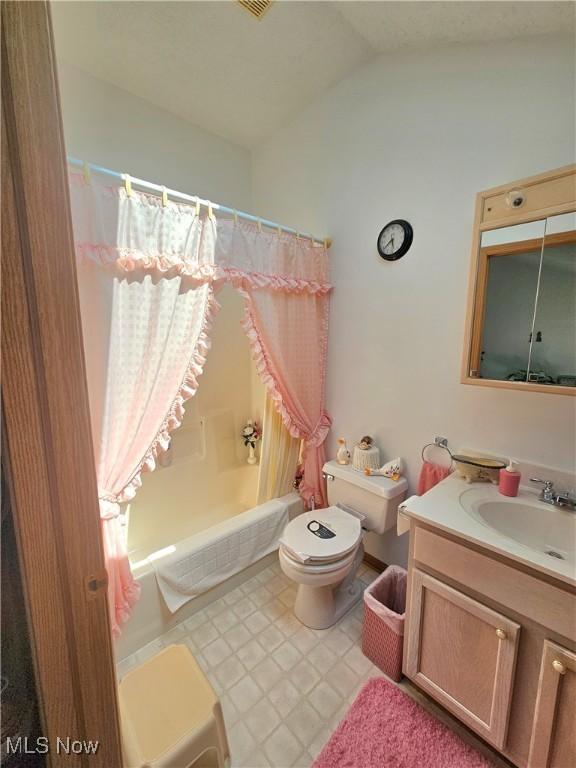 3308 Trappers Trl Unit A, Cortland, OH 44410 - bathroom featuring shower / bath combination with curtain, vanity, and lofted ceiling