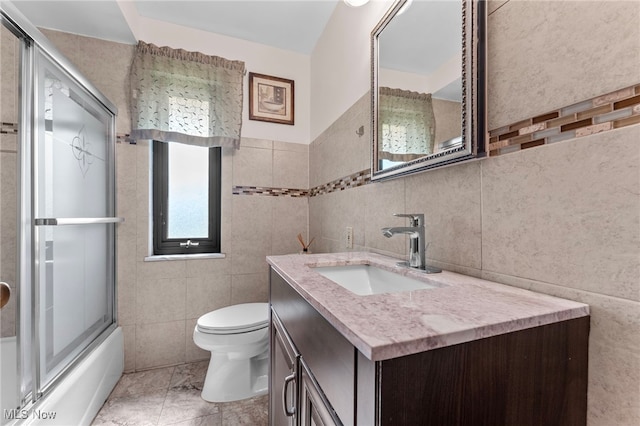 2637 Carmen Dr, Rocky River, OH 44116 - full bath with tile walls, vanity, and enclosed tub / shower combo