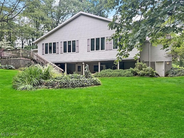 1027 Twp Rd Unit 1806, Ashland, OH 44805 - rear view of property featuring a yard, a wooden deck, and stairway