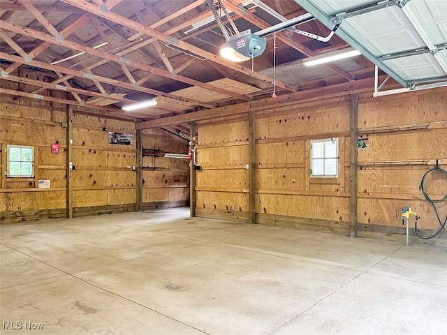 1027 Twp Rd Unit 1806, Ashland, OH 44805 - garage with a garage door opener and wooden walls