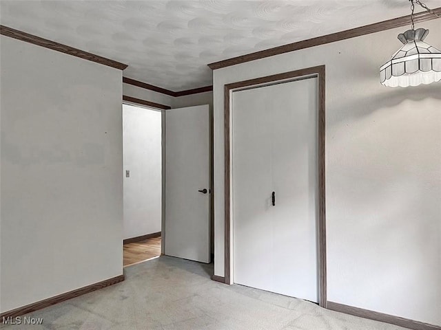 1027 Twp Rd Unit 1806, Ashland, OH 44805 - unfurnished bedroom with crown molding, light carpet, and a closet
