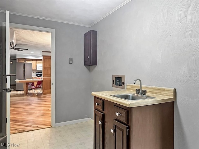 1027 Twp Rd Unit 1806, Ashland, OH 44805 - bar featuring freestanding refrigerator, light flooring, ornamental molding, white microwave, and ceiling fan