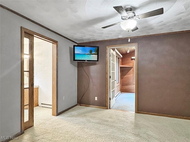 1027 Twp Rd Unit 1806, Ashland, OH 44805 - empty room with carpet, a ceiling fan, ornamental molding, and a baseboard radiator