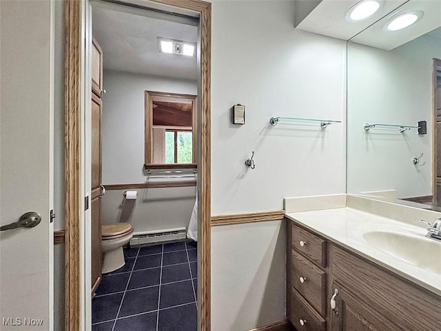 1027 Twp Rd Unit 1806, Ashland, OH 44805 - bathroom with baseboard heating, vanity, and tile patterned floors