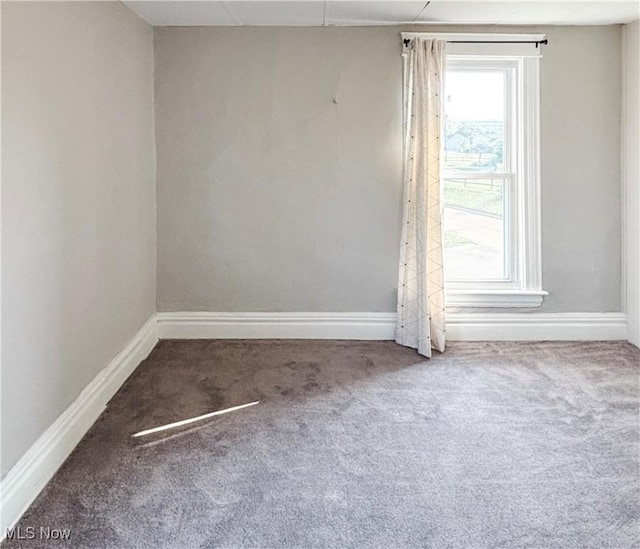 1021 12th Ave, Vienna, WV 26105 - carpeted empty room with baseboards
