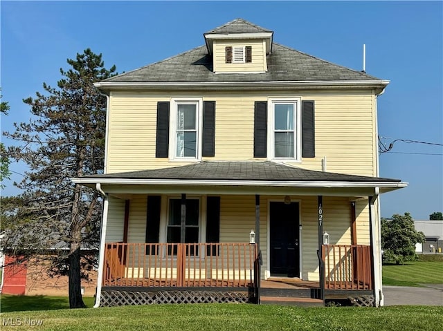 1021 12th Ave, Vienna, WV 26105 - view of front of home featuring covered porch and a front lawn
