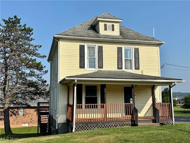 1021 12th Ave, Vienna, WV 26105 - american foursquare style home featuring a front yard, a porch, and stairs