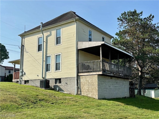 1021 12th Ave, Vienna, WV 26105 - view of property exterior with a yard and a balcony